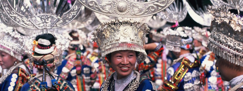 A Miao minority woman in traditional costume in Guizhou China